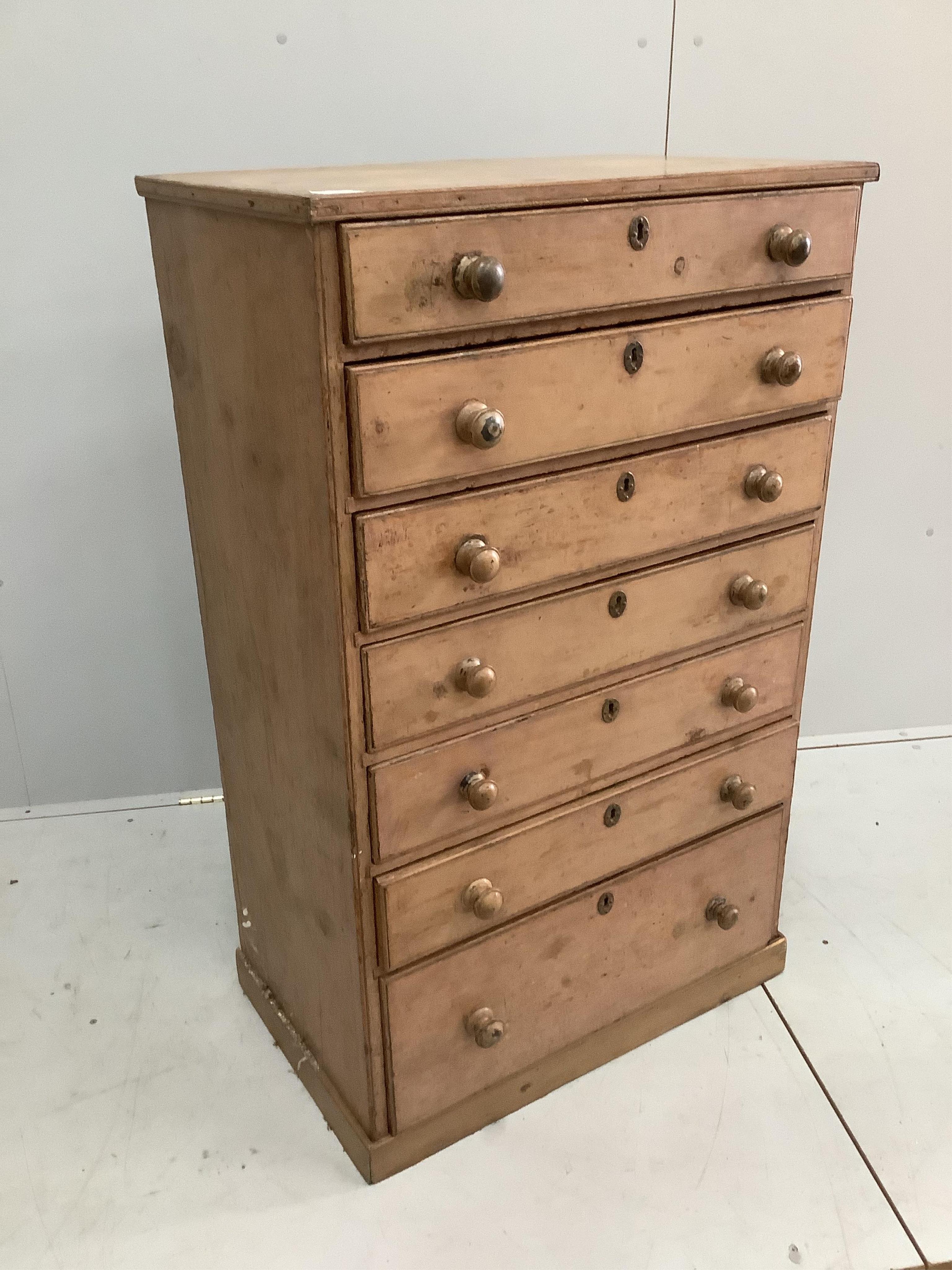 A French mid 19th century painted pine narrow chest of seven drawers, width 73cm, depth 44cm, height 117cm. Condition - fair